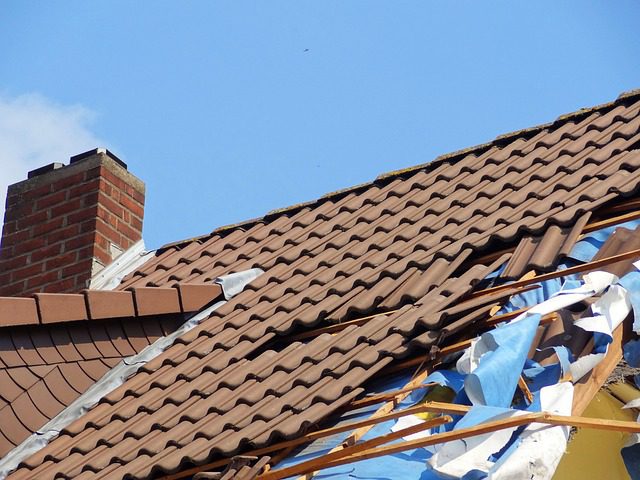 A roof with storm damage, Repair Or Replace My Roof